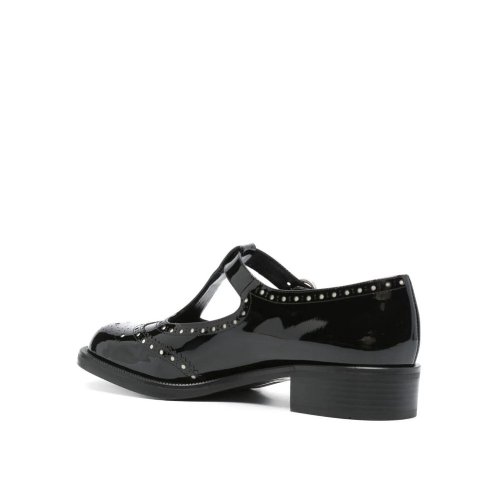 Miu Miu — Ballerines en cuir de veau verni avec détails ajourés