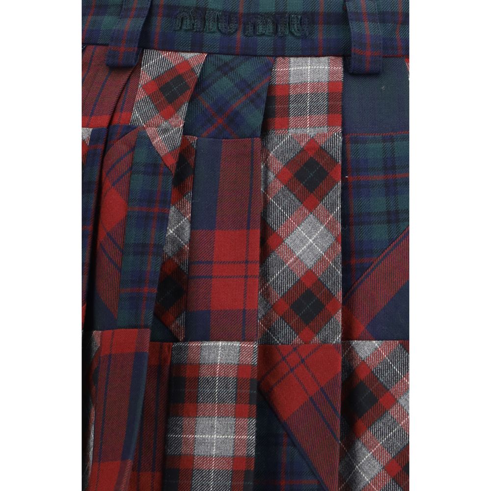 Miu Miu — Mini-jupe plissée patchwork tartan en laine