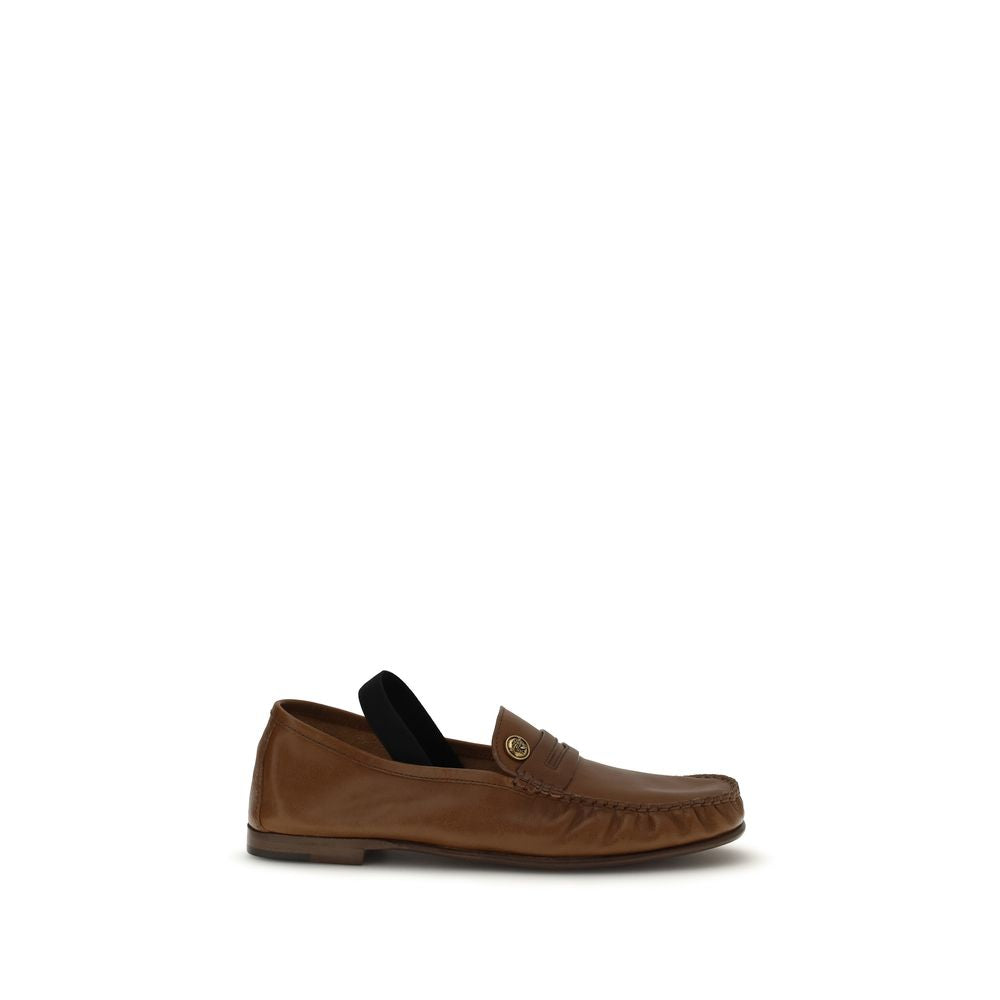 Versace – Loafers en cuir effet vintage avec Medusa