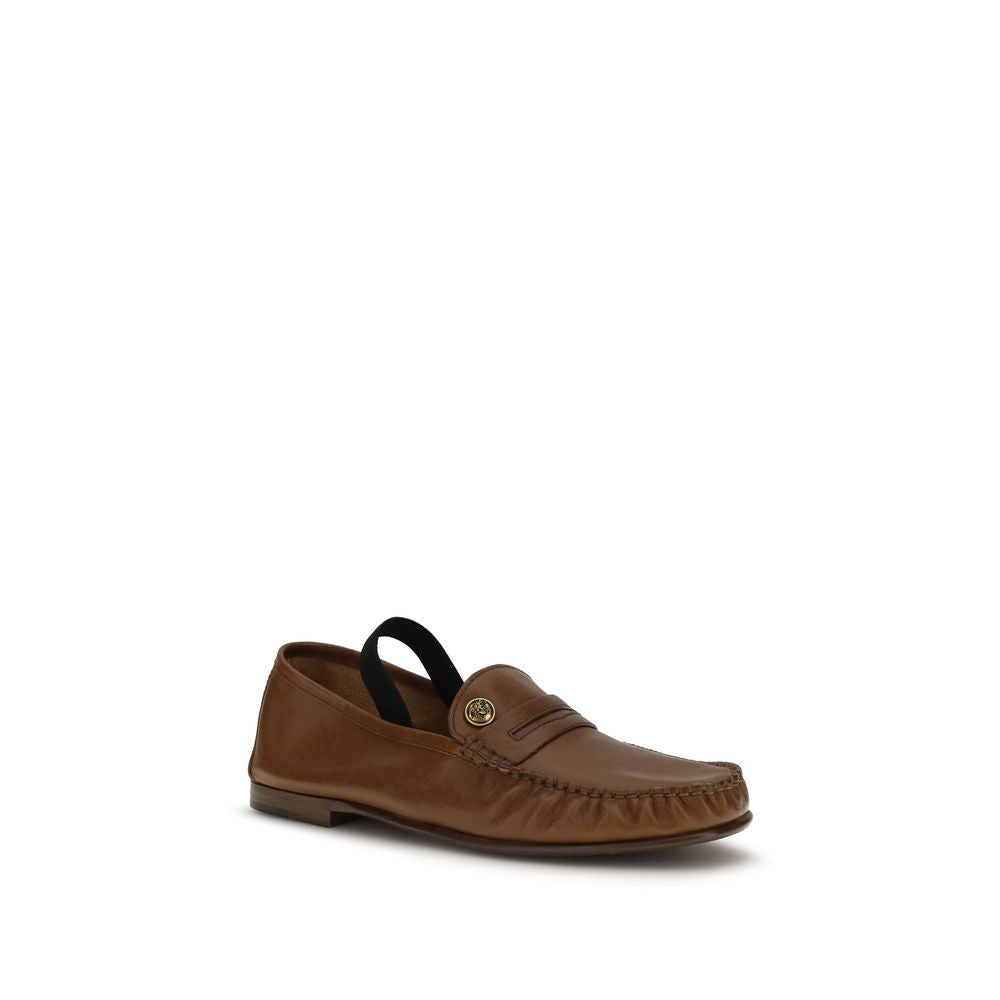 Versace – Loafers en cuir effet vintage avec Medusa