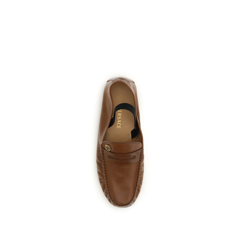 Versace – Loafers en cuir effet vintage avec Medusa