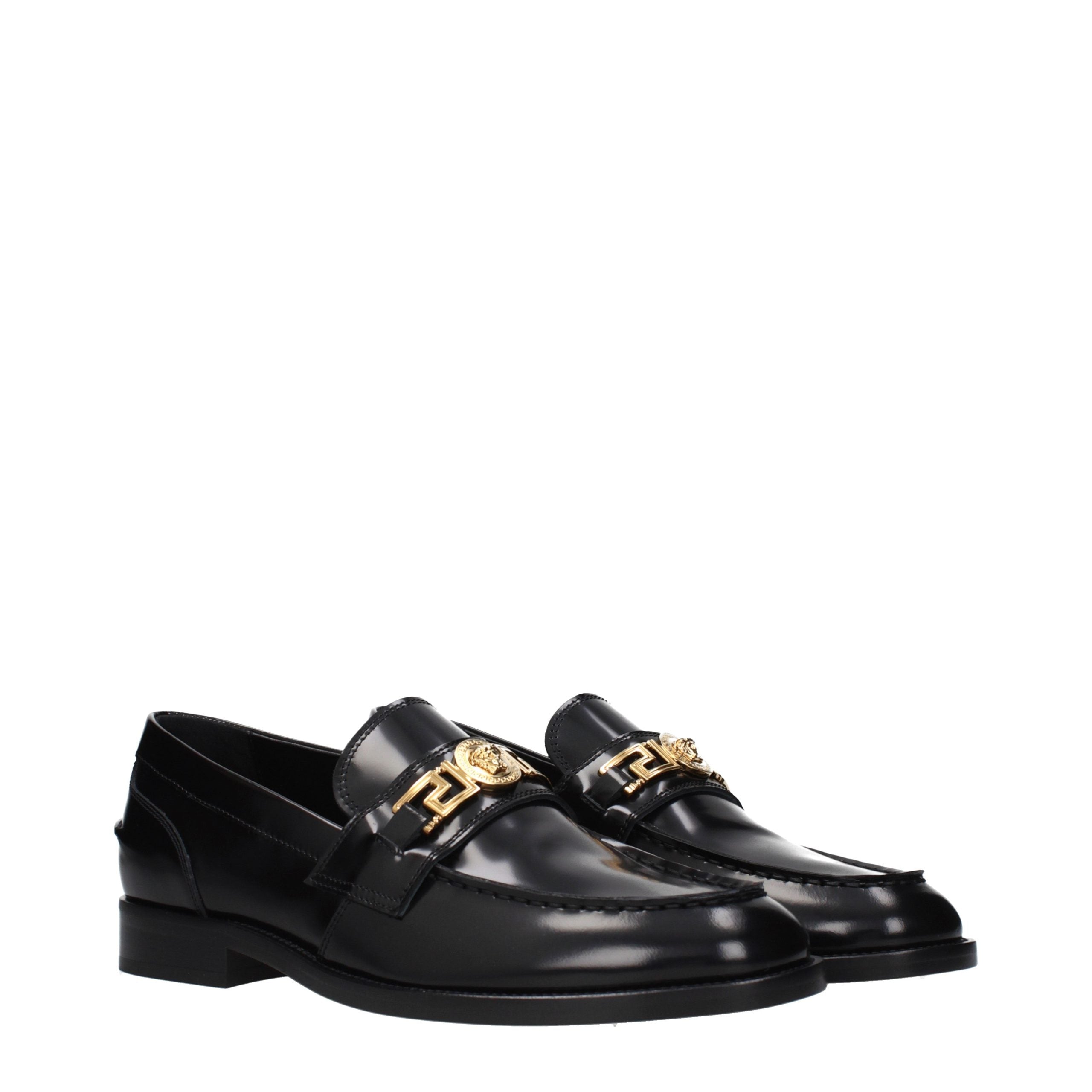 Versace – Loafers en cuir noir avec détail signature