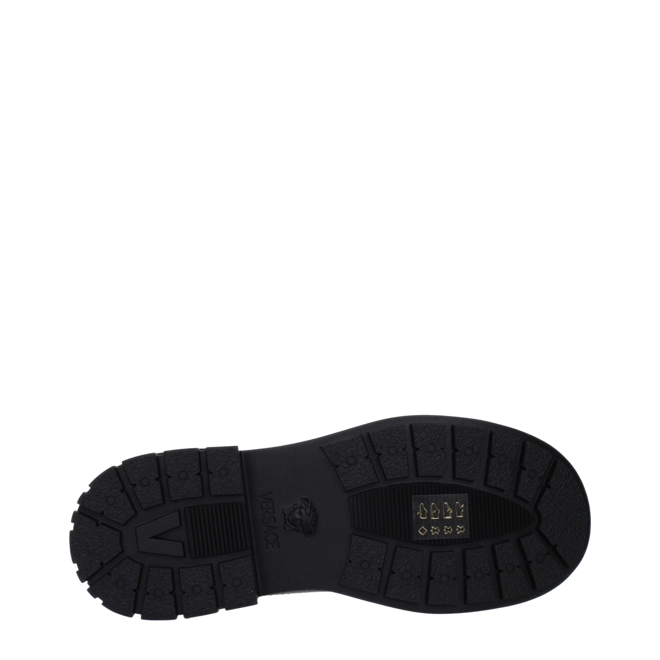 Versace – Bottines en cuir noir avec détails signature