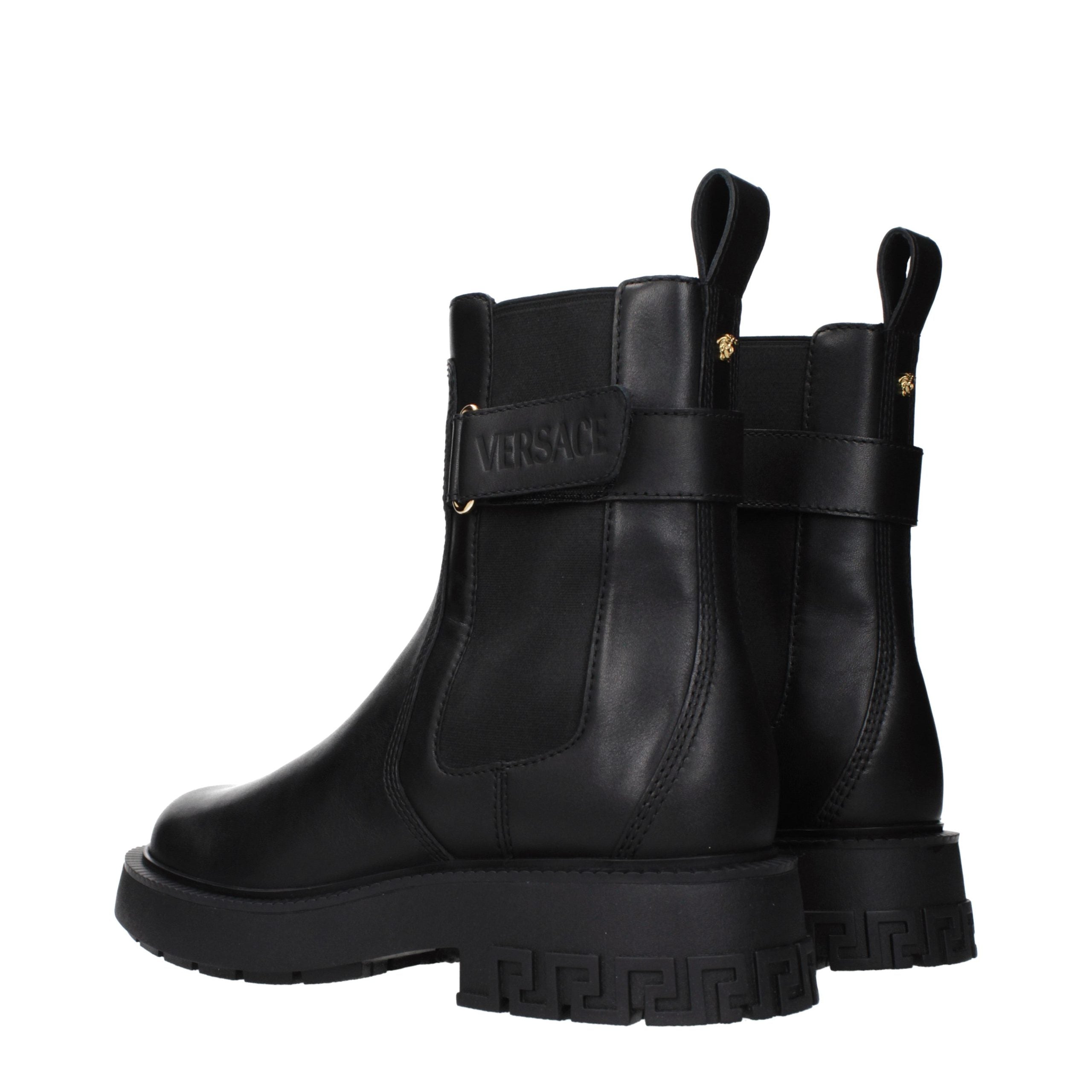 Versace – Bottines en cuir noir avec détails logo
