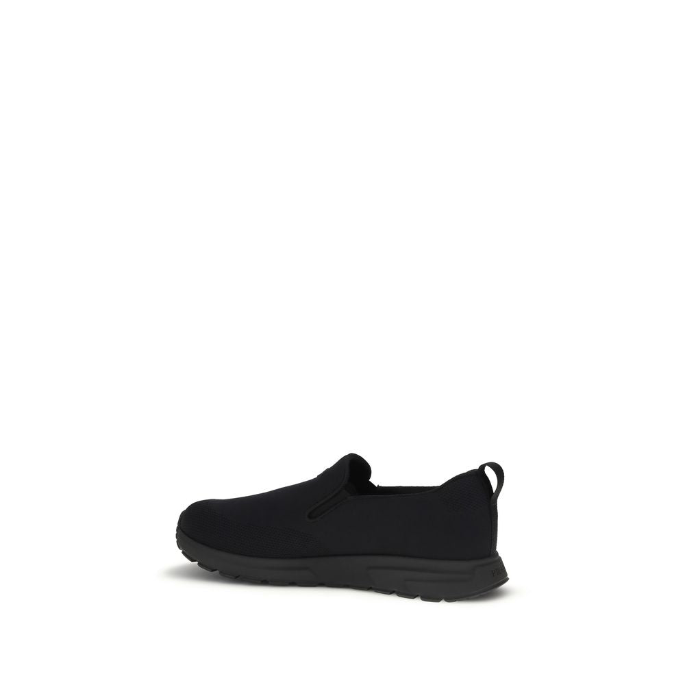 Prada – Sneakers slip-on en jersey avec logo caoutchouté