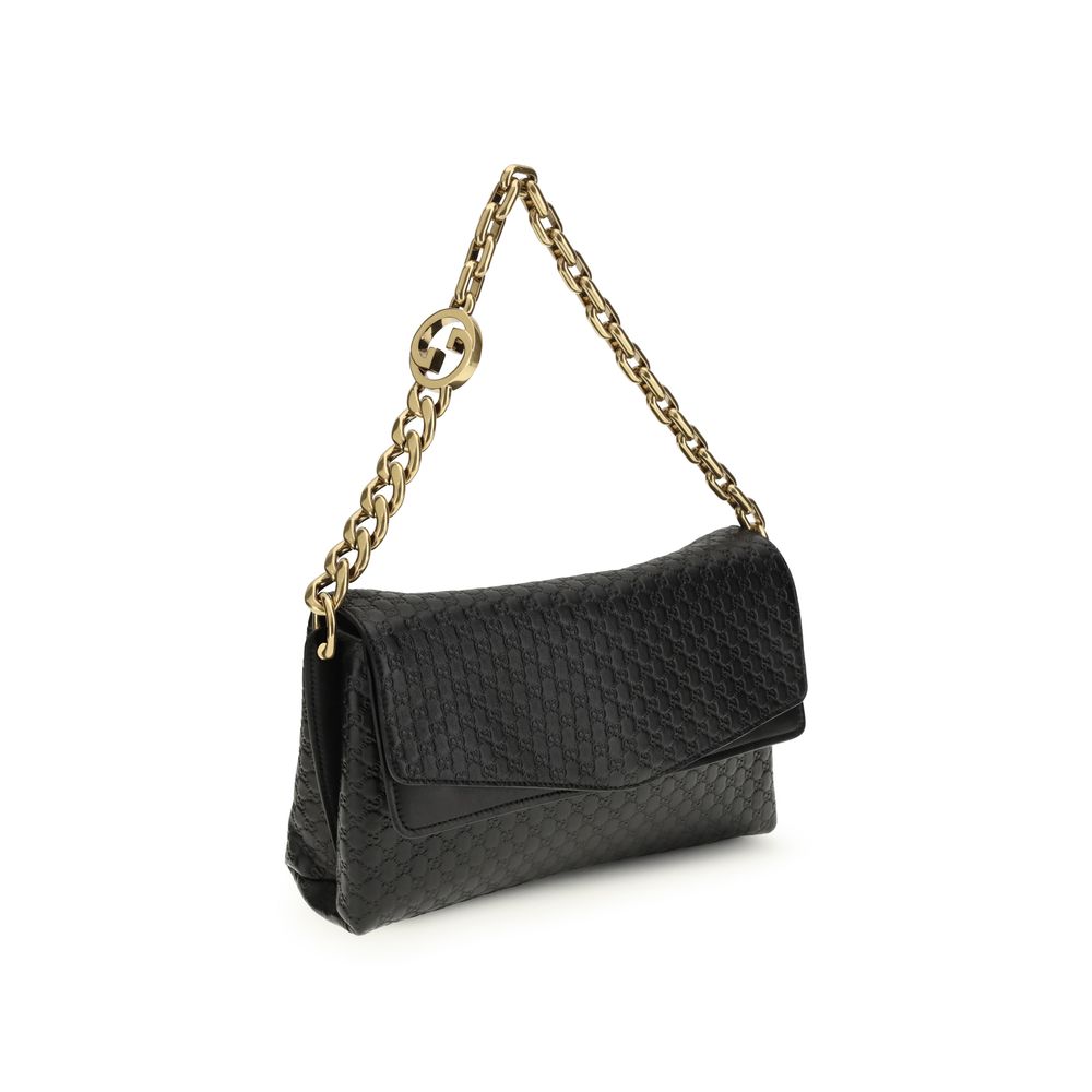 Gucci – Sac porté épaule medium à chaîne en cuir GG embossé
