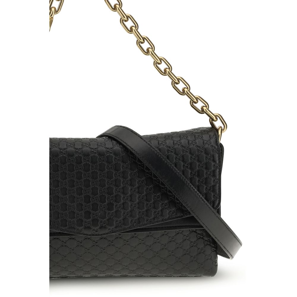 Gucci – Sac porté épaule medium à chaîne en cuir GG embossé