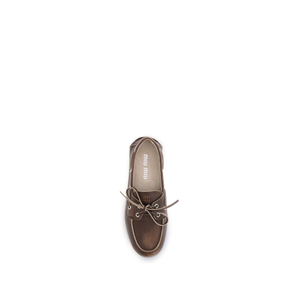 Miu Miu – Loafers bateau en cuir effet vieilli