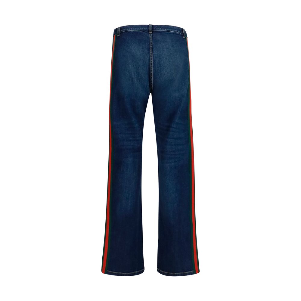 Gucci – Jean flare en coton avec bande Web