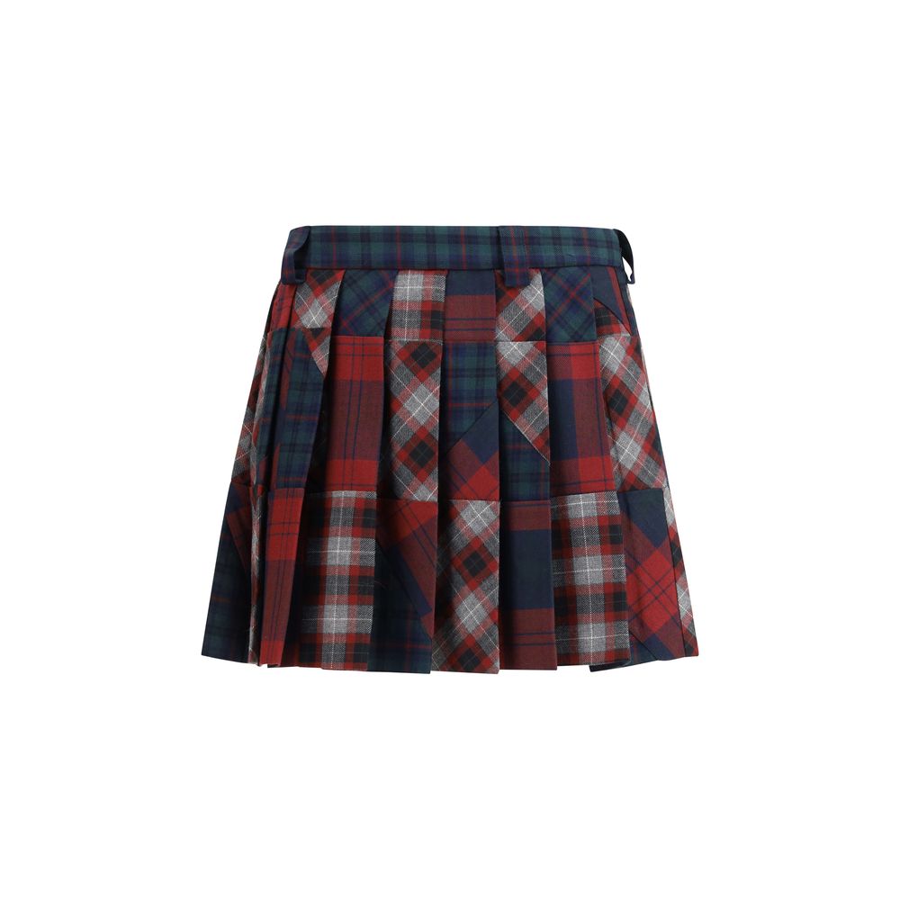 Miu Miu — Mini-jupe plissée patchwork tartan en laine