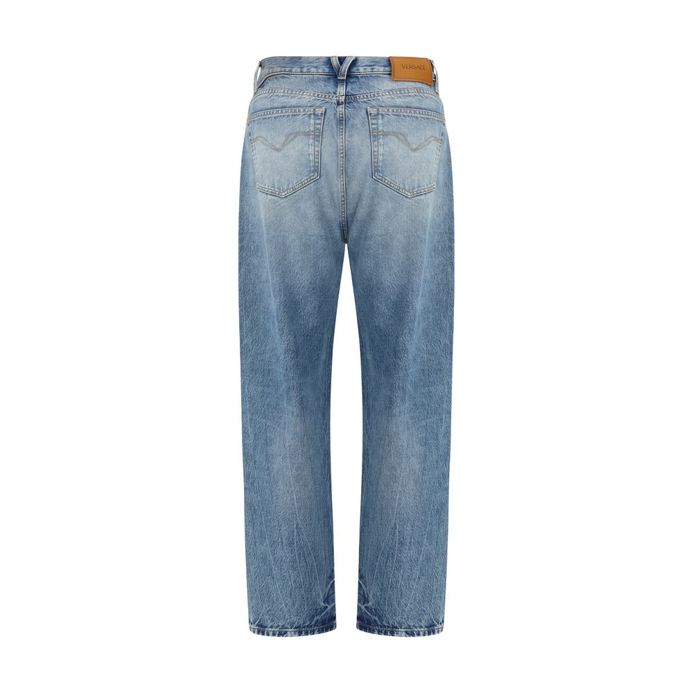 Versace — Jean en denim bleu effet usé avec emblème Medusa Biggie