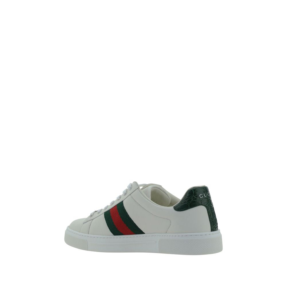 Gucci — Sneakers basses blanches en cuir de veau avec bandes Web iconiques