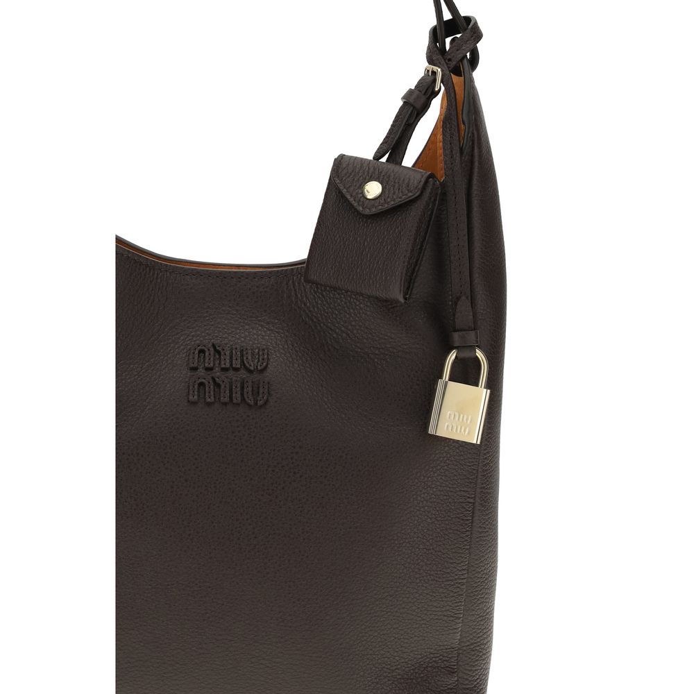 Miu Miu — Sac bucket en cuir martelé marron