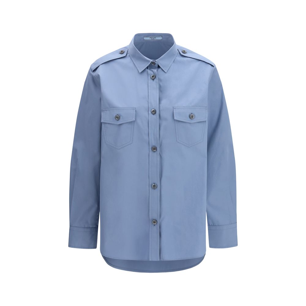 Prada — Chemise en popeline de coton bleu (Oversize)
Cette chemise en popeline