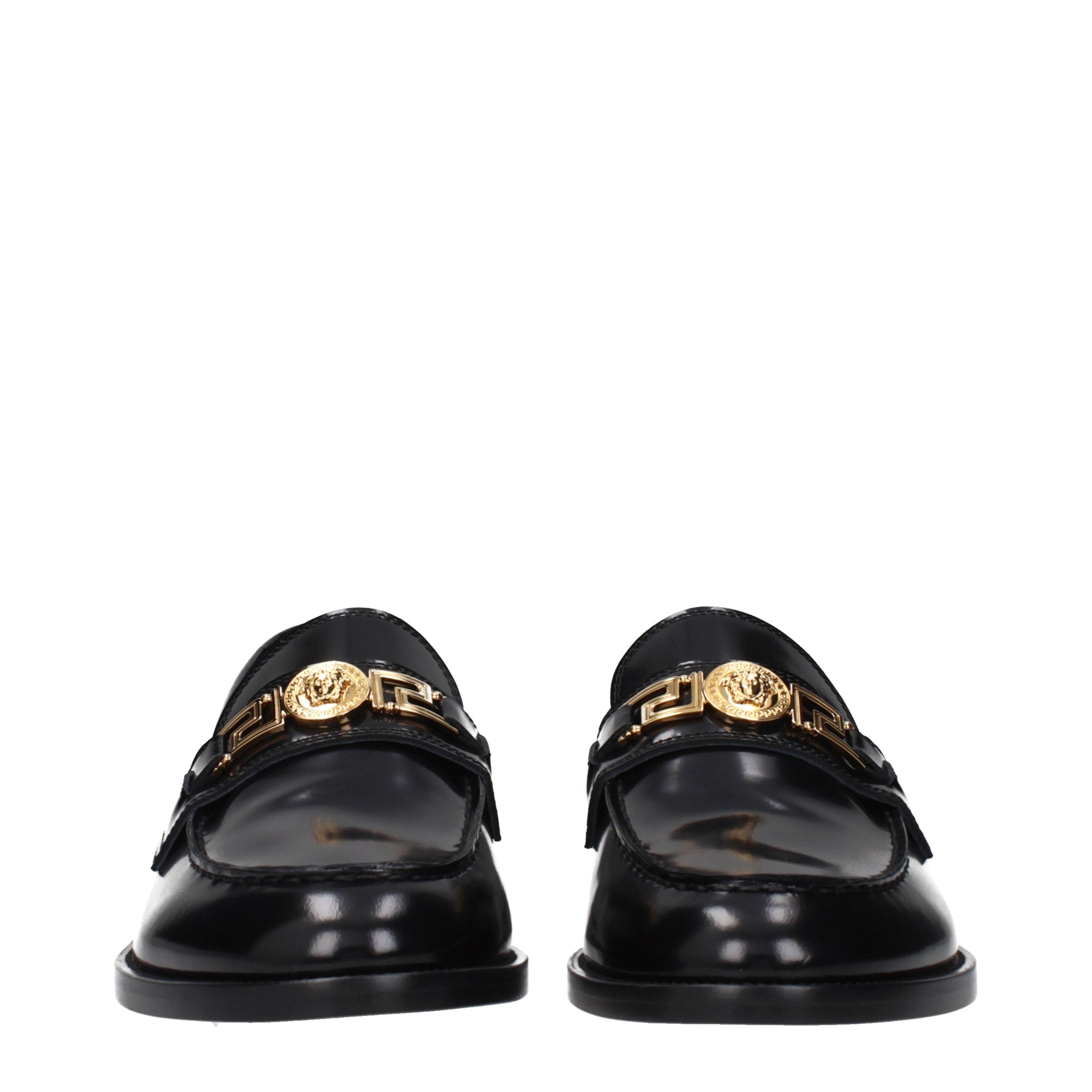 Versace – Loafers en cuir noir avec détail signature