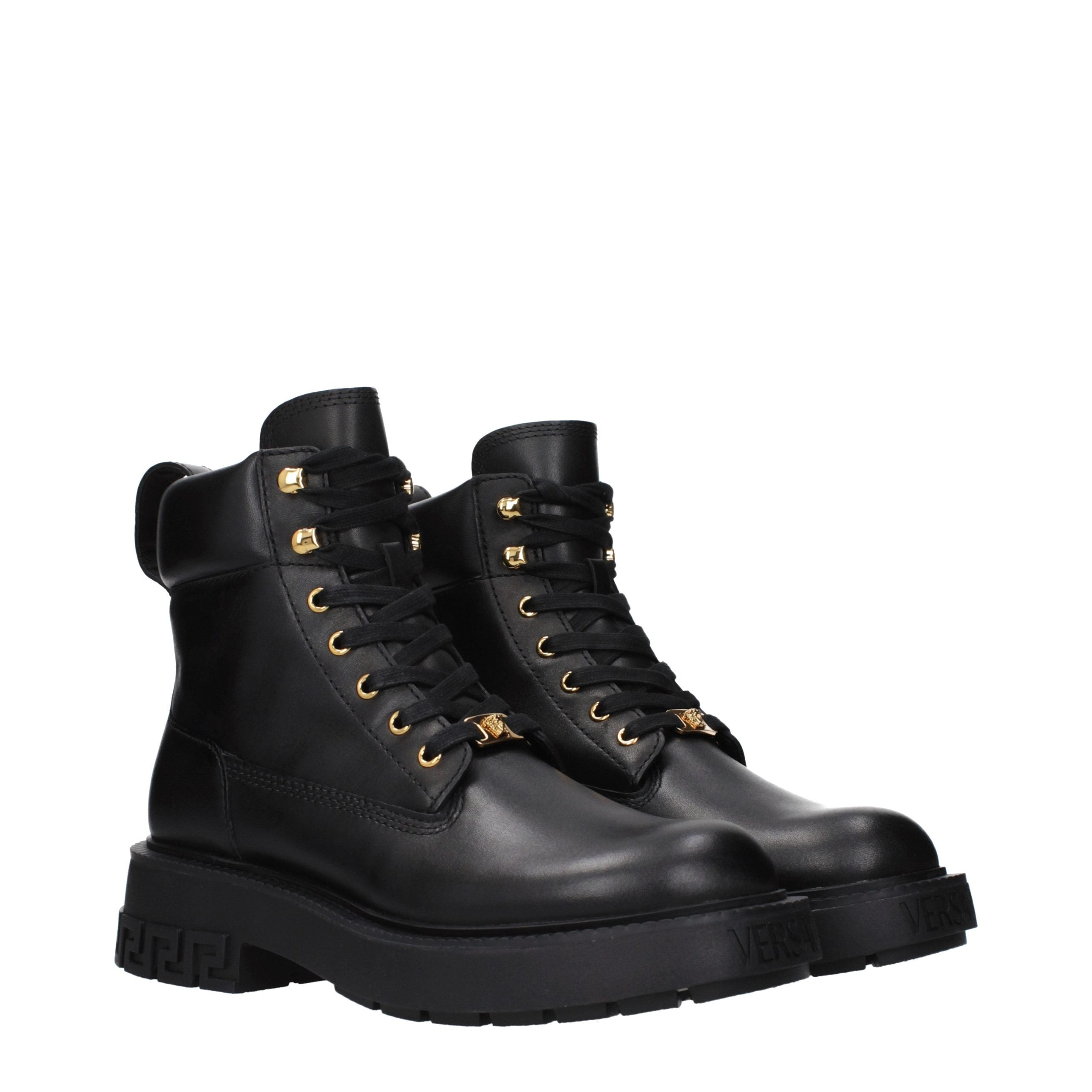 Versace – Bottines en cuir noir avec détails signature
