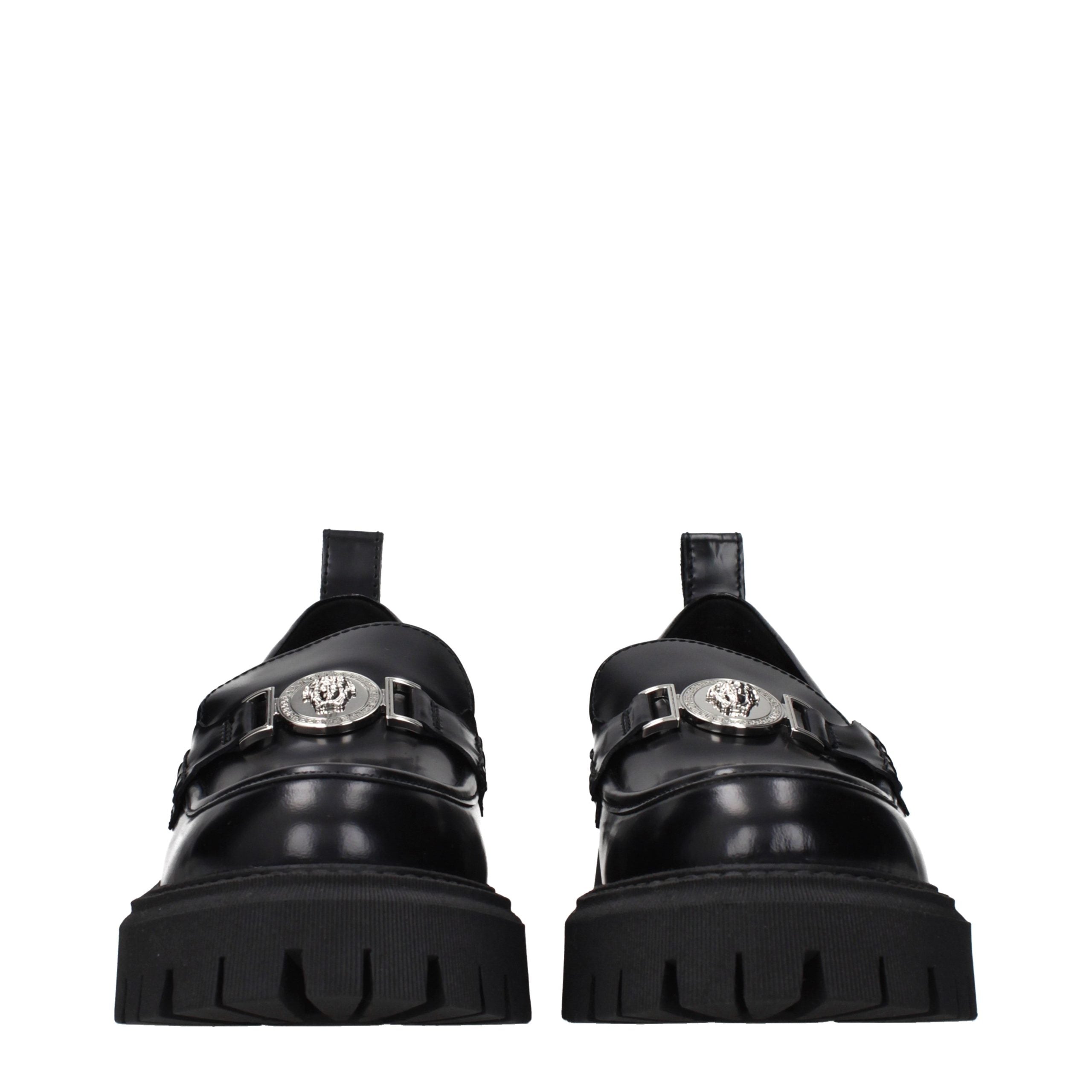 Versace – Loafers en cuir noir avec détail frontal