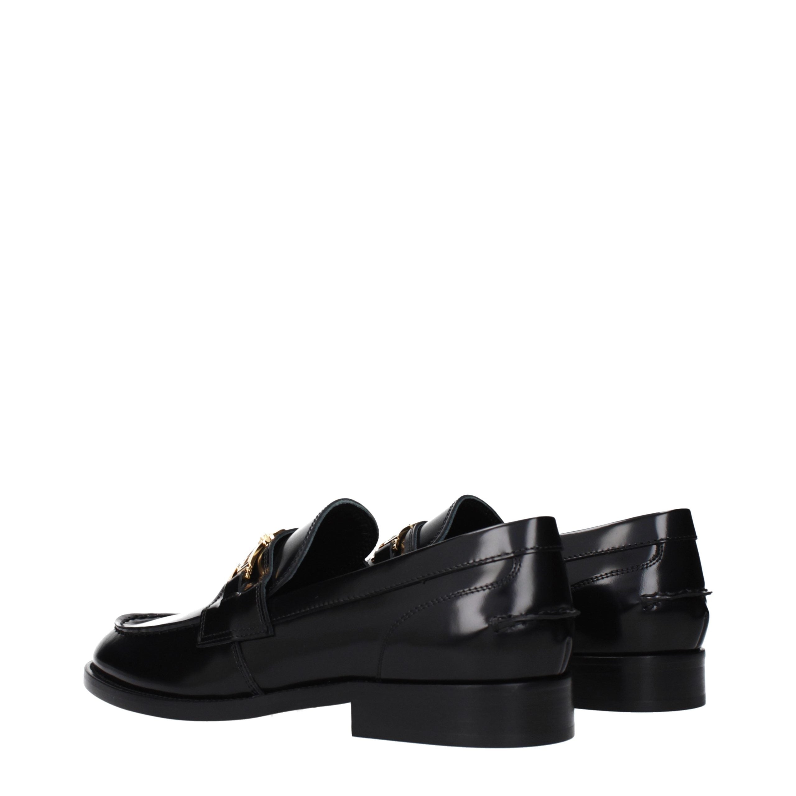 Versace – Loafers en cuir noir avec détail signature