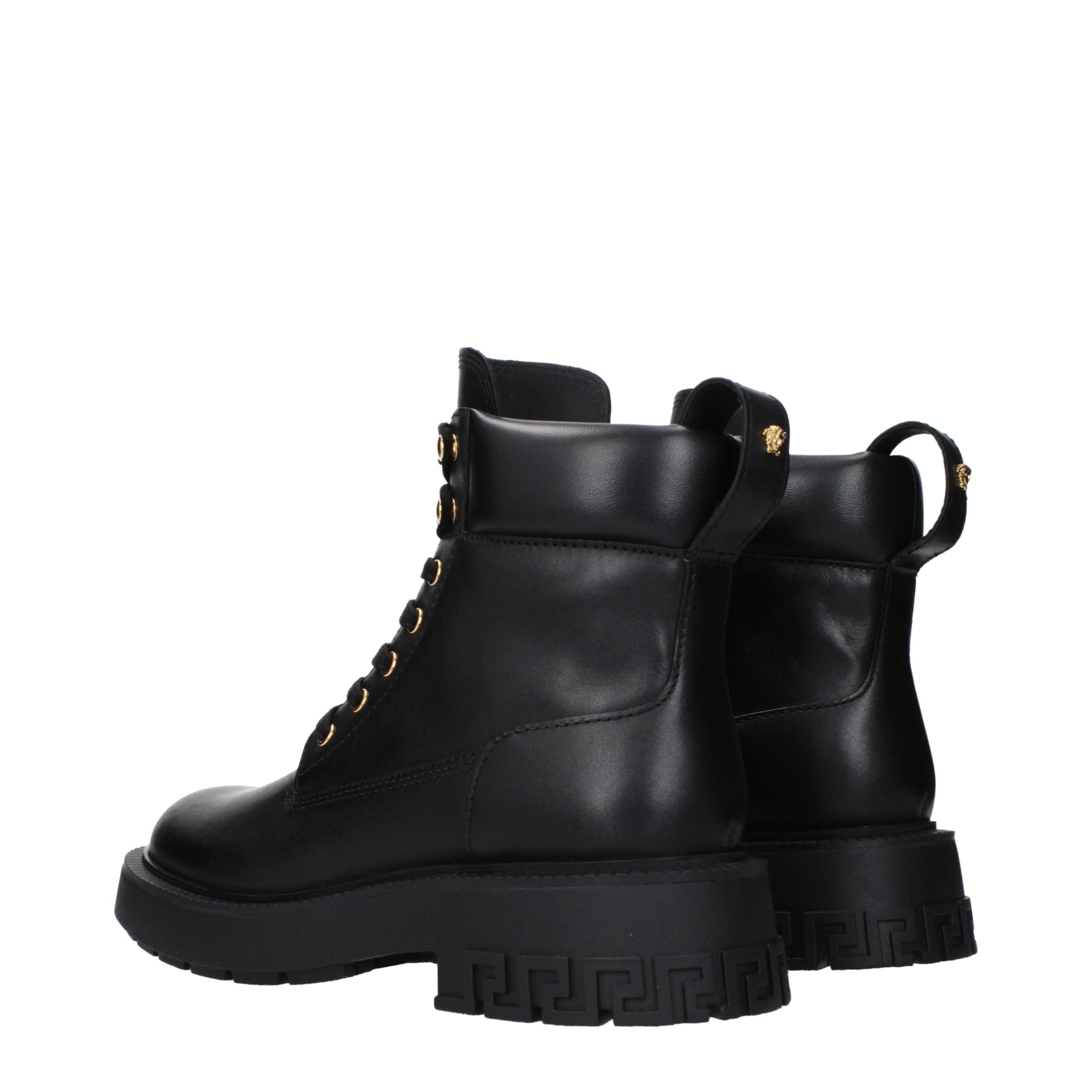 Versace – Bottines en cuir noir avec détails signature