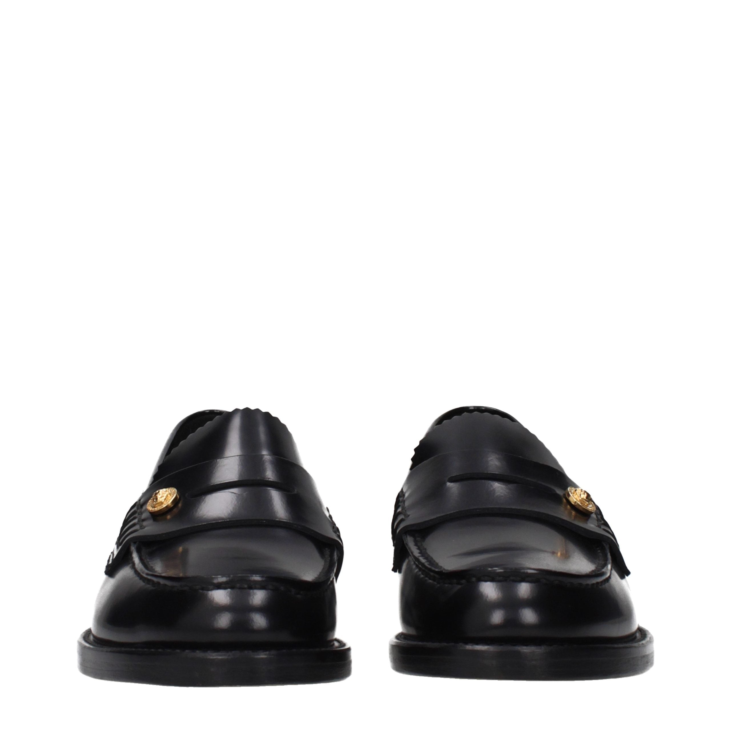 Versace – Loafers en cuir noir avec détail latéral