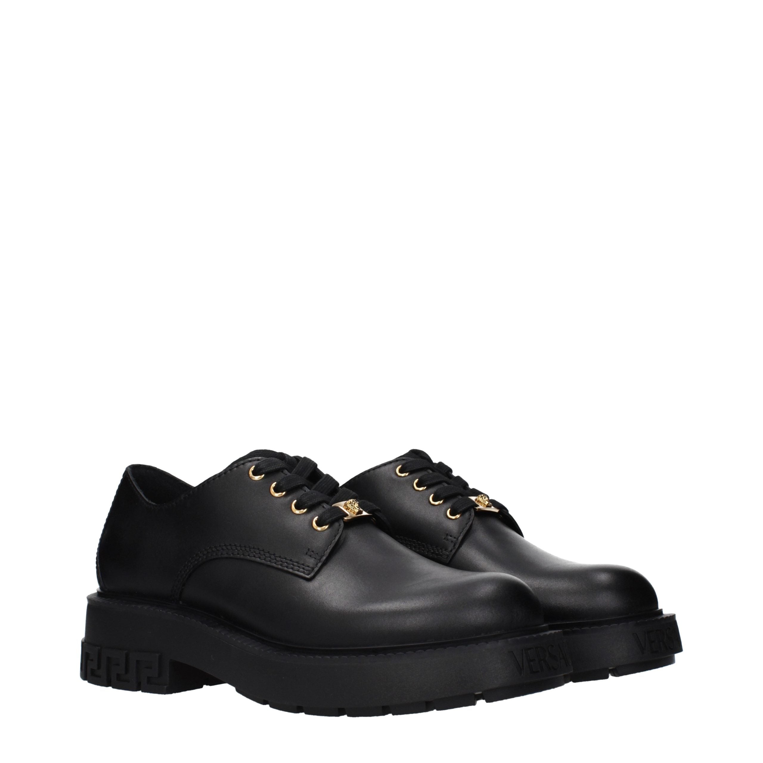 Versace – Chaussures lace-up et monkstrap en cuir noir