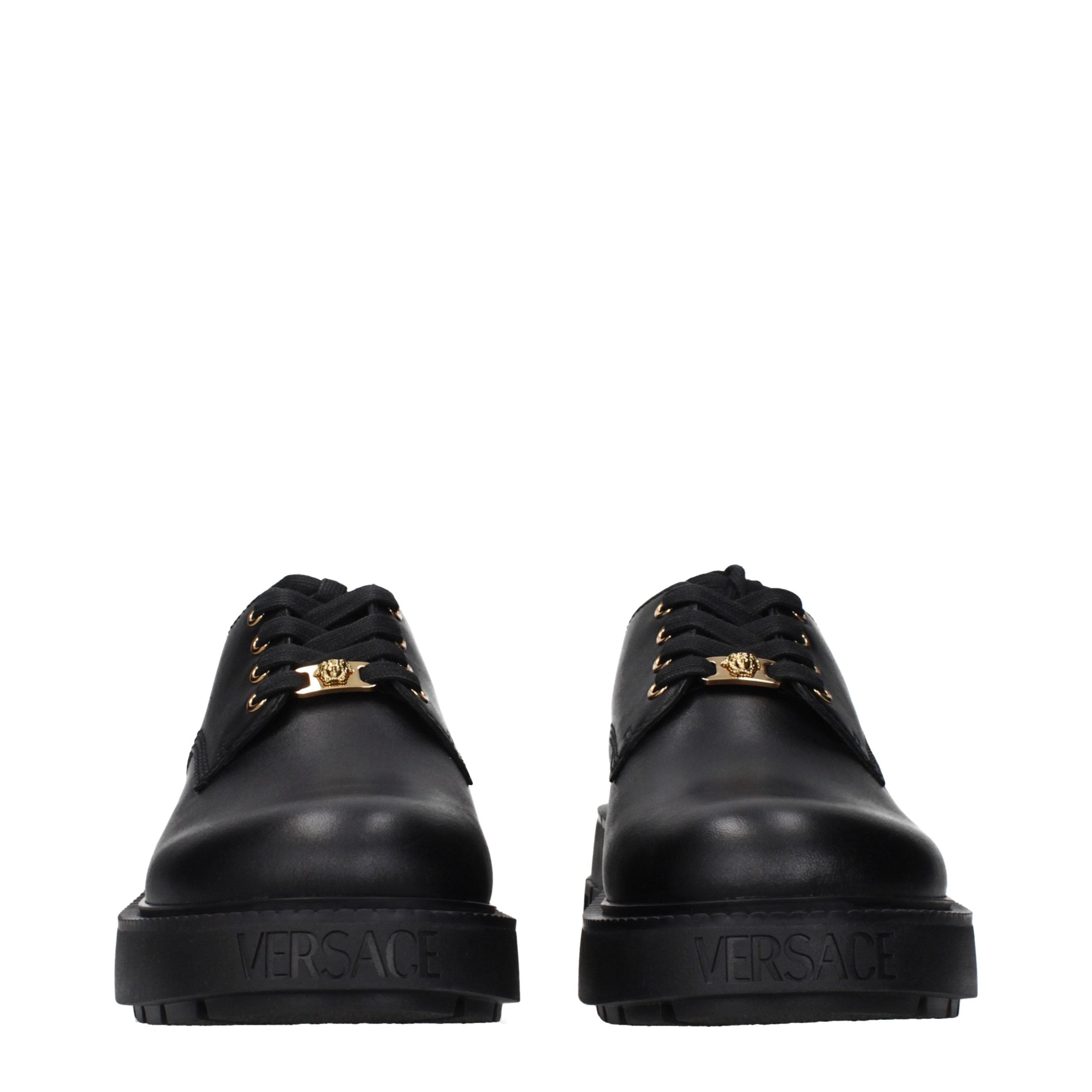Versace – Chaussures lace-up et monkstrap en cuir noir