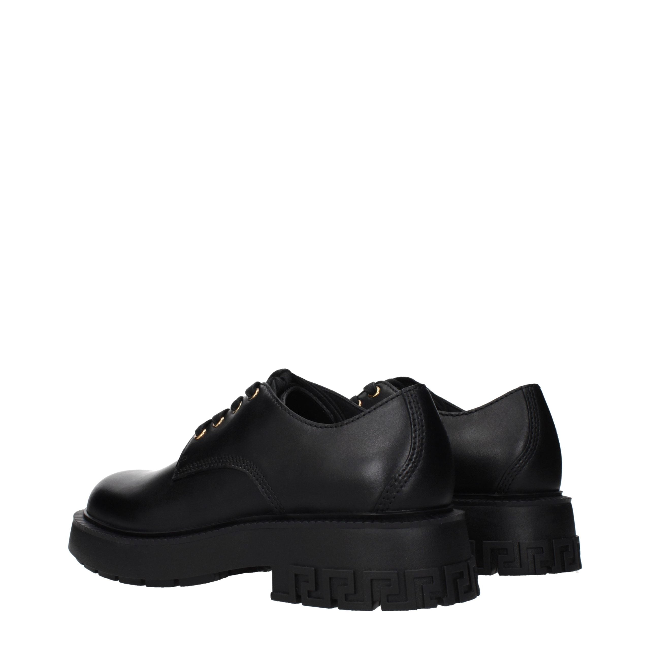 Versace – Chaussures lace-up et monkstrap en cuir noir