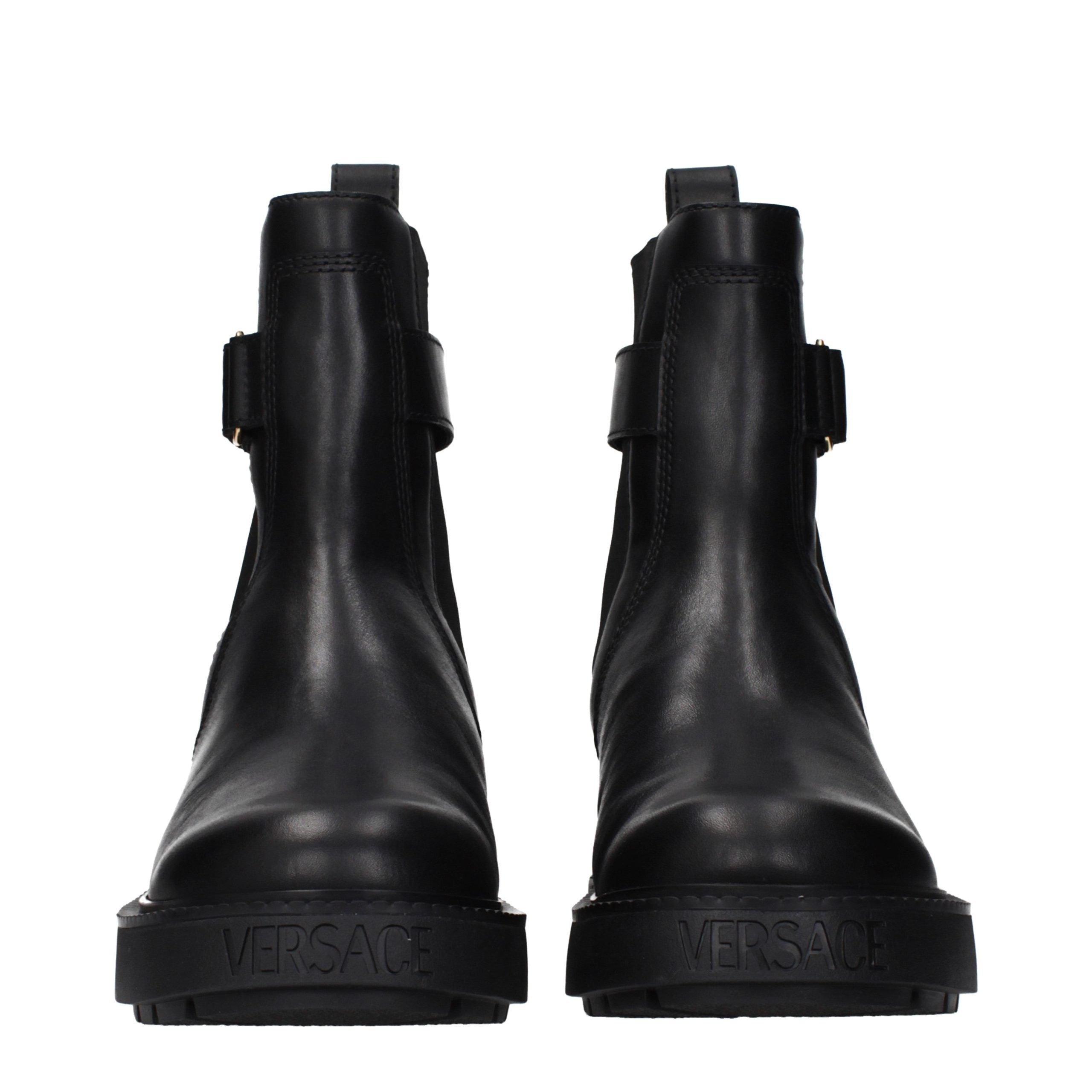 Versace – Bottines en cuir noir avec détails logo