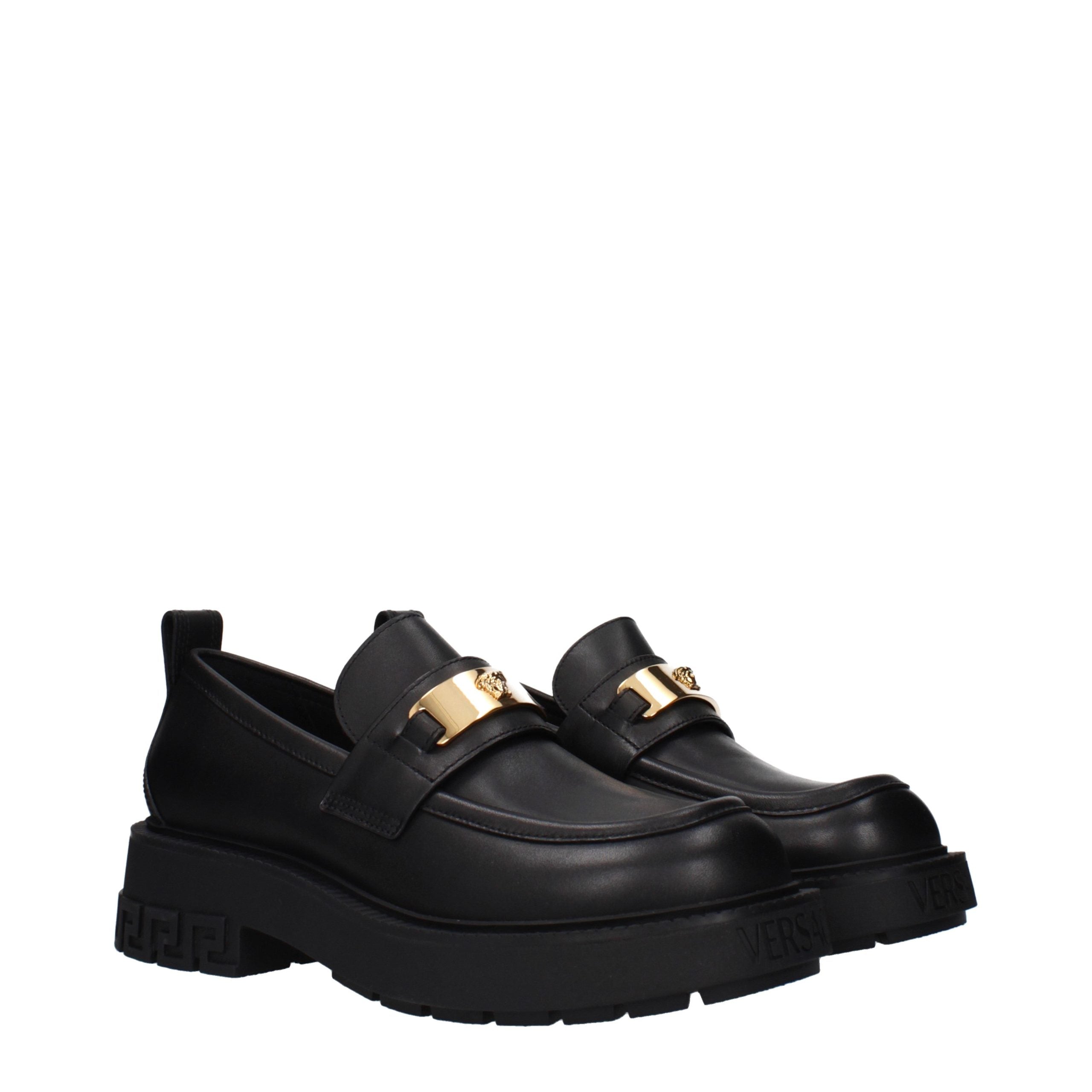 Versace – Mocassins en cuir noir avec détails signature