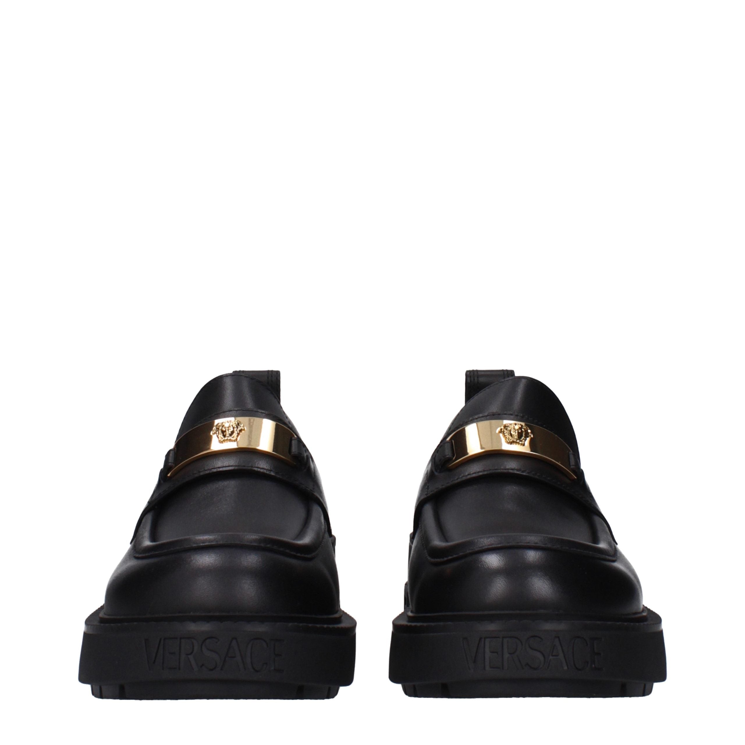 Versace – Mocassins en cuir noir avec détails signature