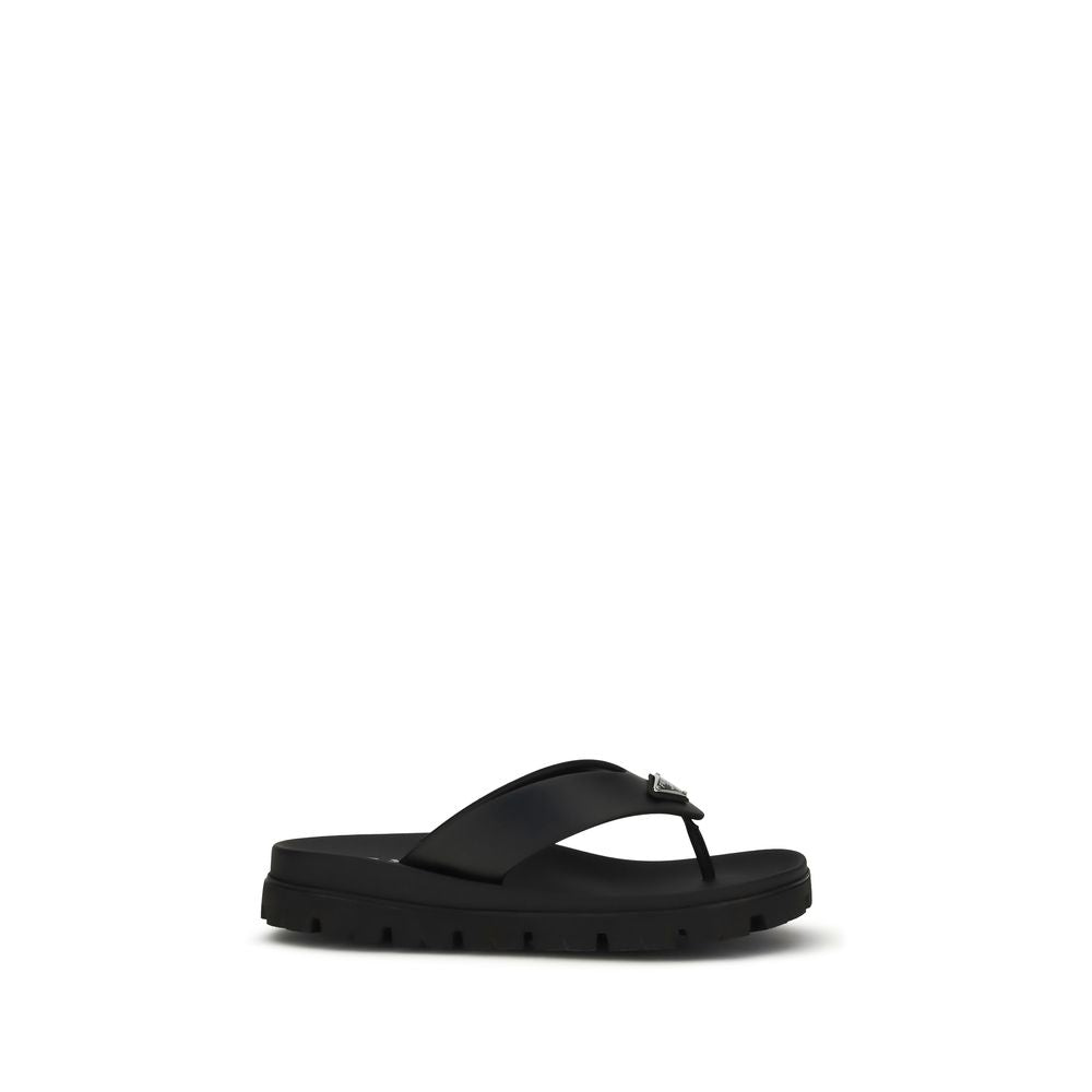 Prada – Sandales flip-flop en cuir avec triangle iconique