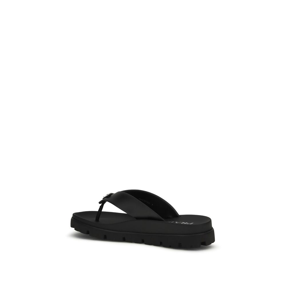 Prada – Sandales flip-flop en cuir avec triangle iconique