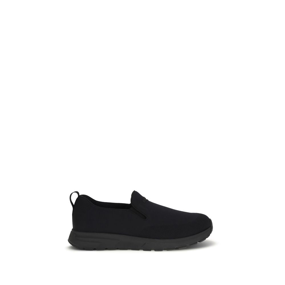 Prada – Sneakers slip-on en jersey avec patch logo