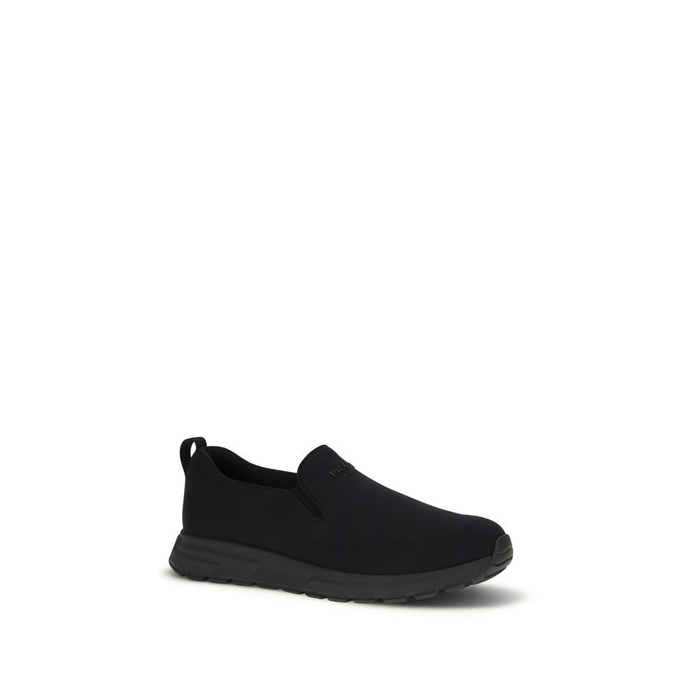 Prada – Sneakers slip-on en jersey avec patch logo