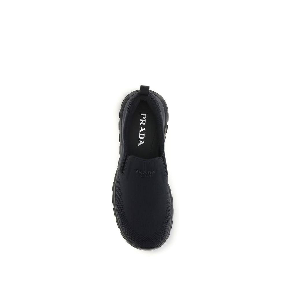 Prada – Sneakers slip-on en jersey avec logo caoutchouté