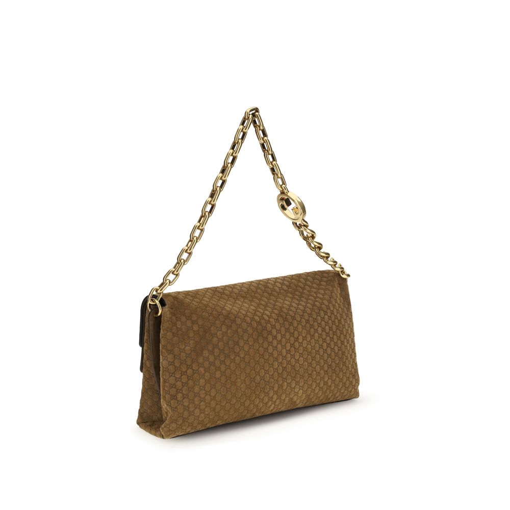 Gucci – Grand sac porté épaule en suède embossé GG