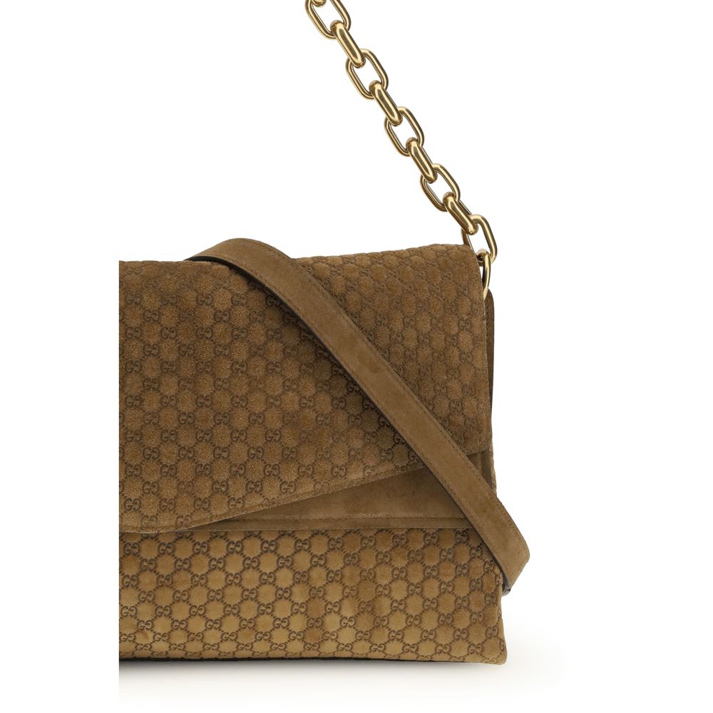 Gucci – Grand sac porté épaule en suède embossé GG