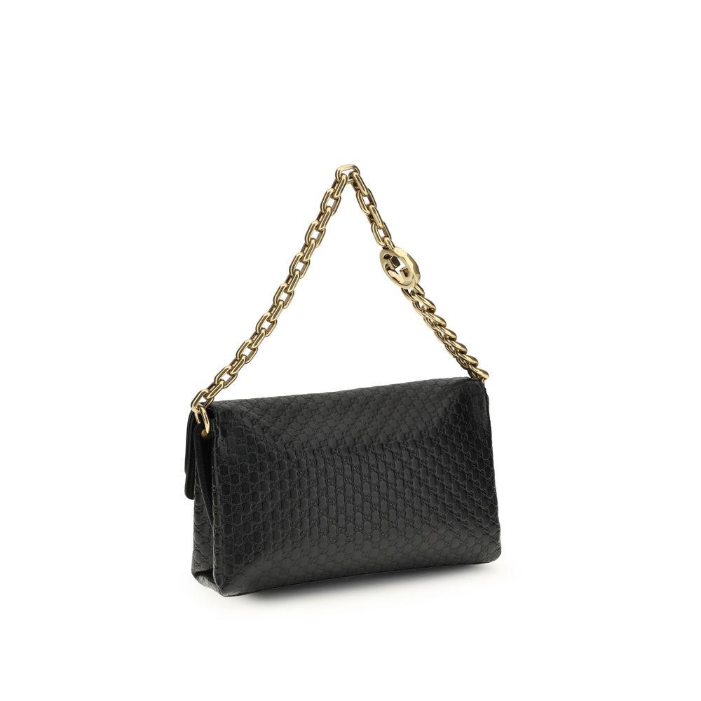 Gucci – Sac porté épaule medium à chaîne en cuir GG embossé
