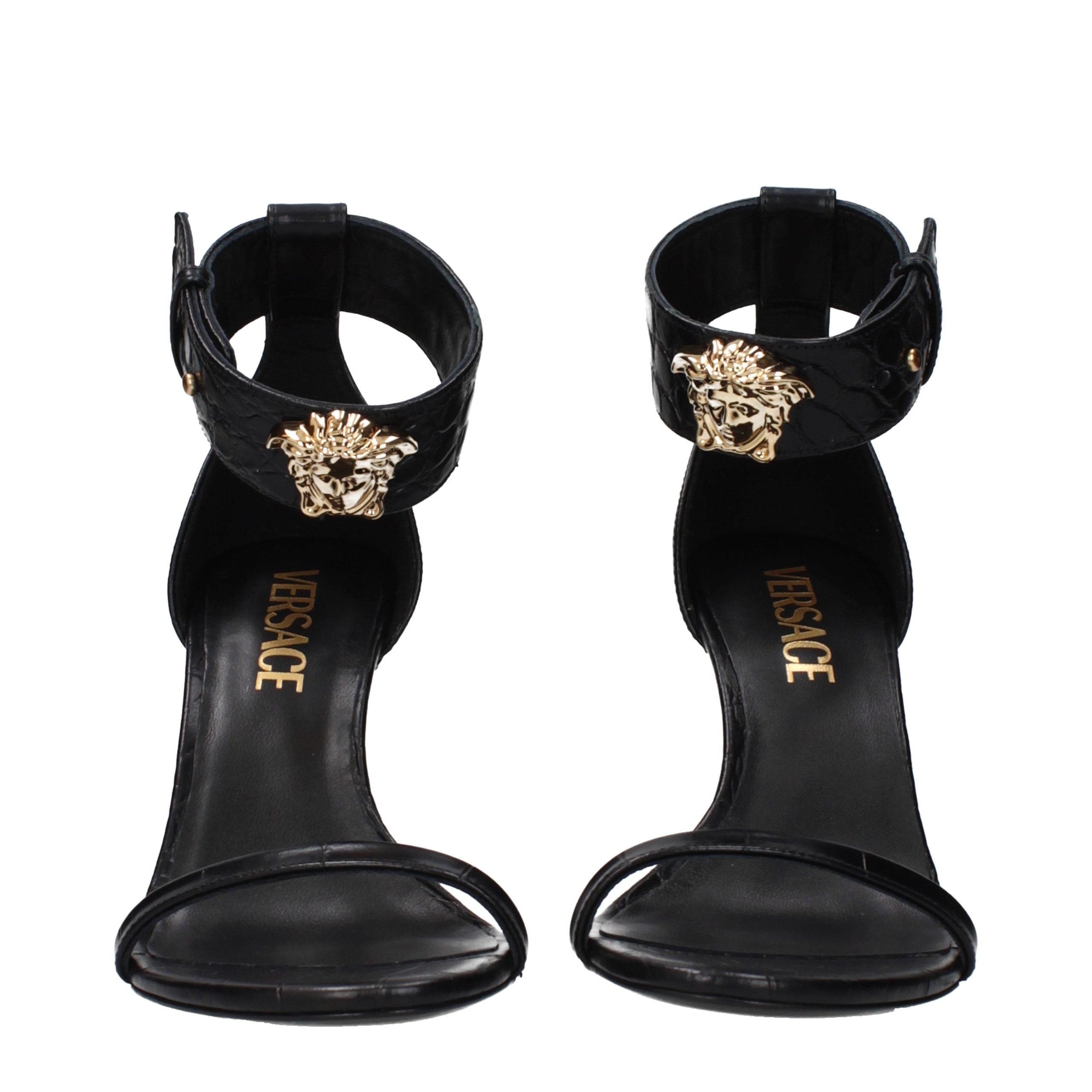 Versace – Sandales en cuir noir avec détail latéral