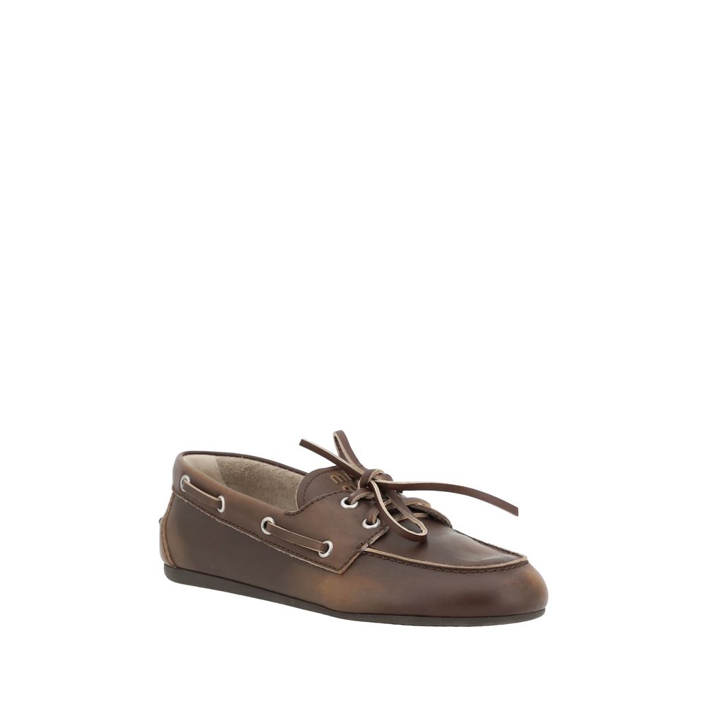 Miu Miu – Loafers bateau en cuir effet vieilli