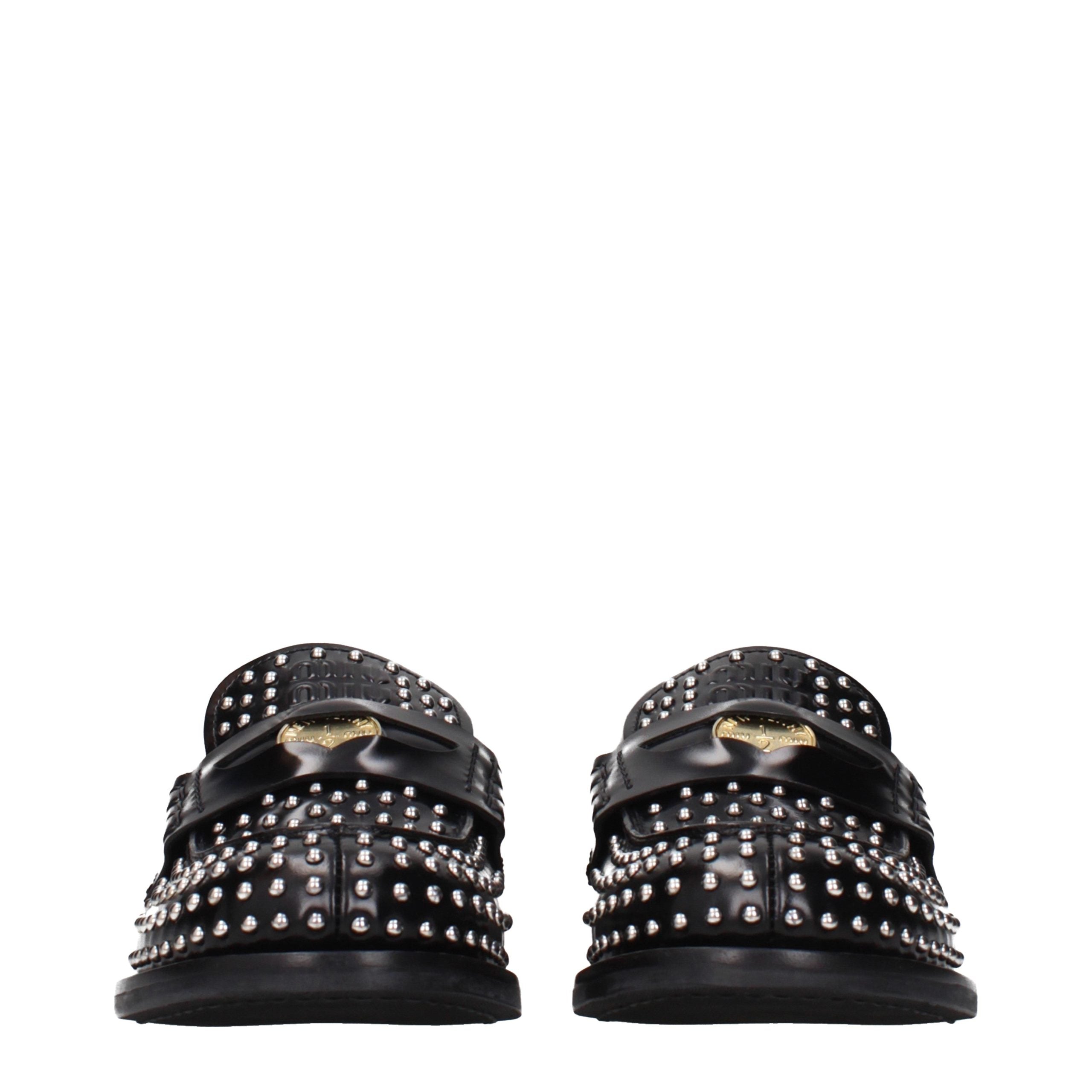 Miu Miu – Loafers en cuir noir à clous