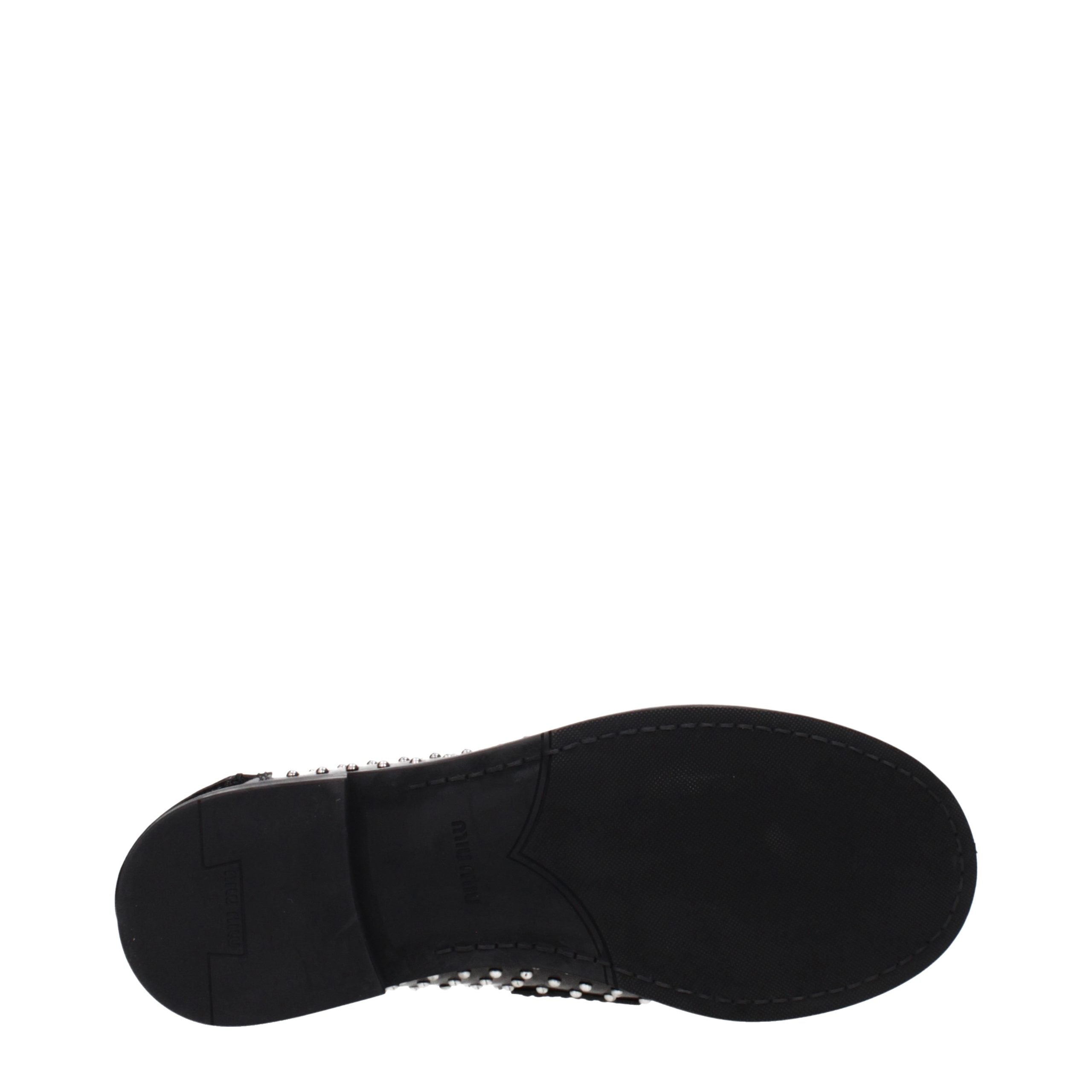 Miu Miu – Loafers en cuir noir à clous